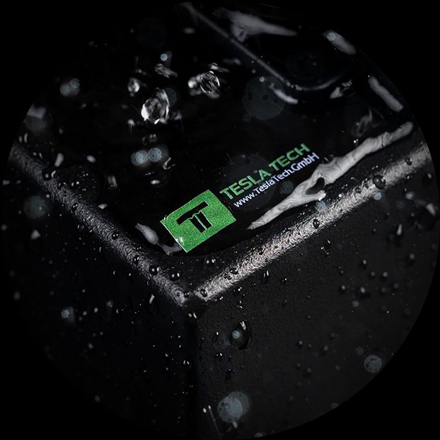 Tesla Tech logo on a water-sprayed PDU enclosure