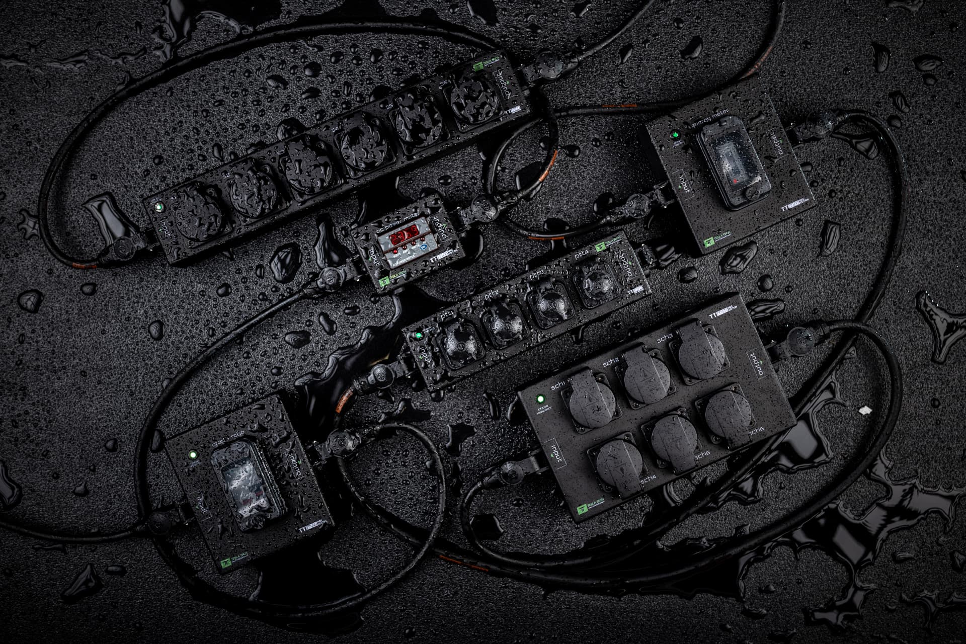 Tesla Tech modular PDUs with Schuko, powerCON TRUE1 and metering modules connected on a wet surface