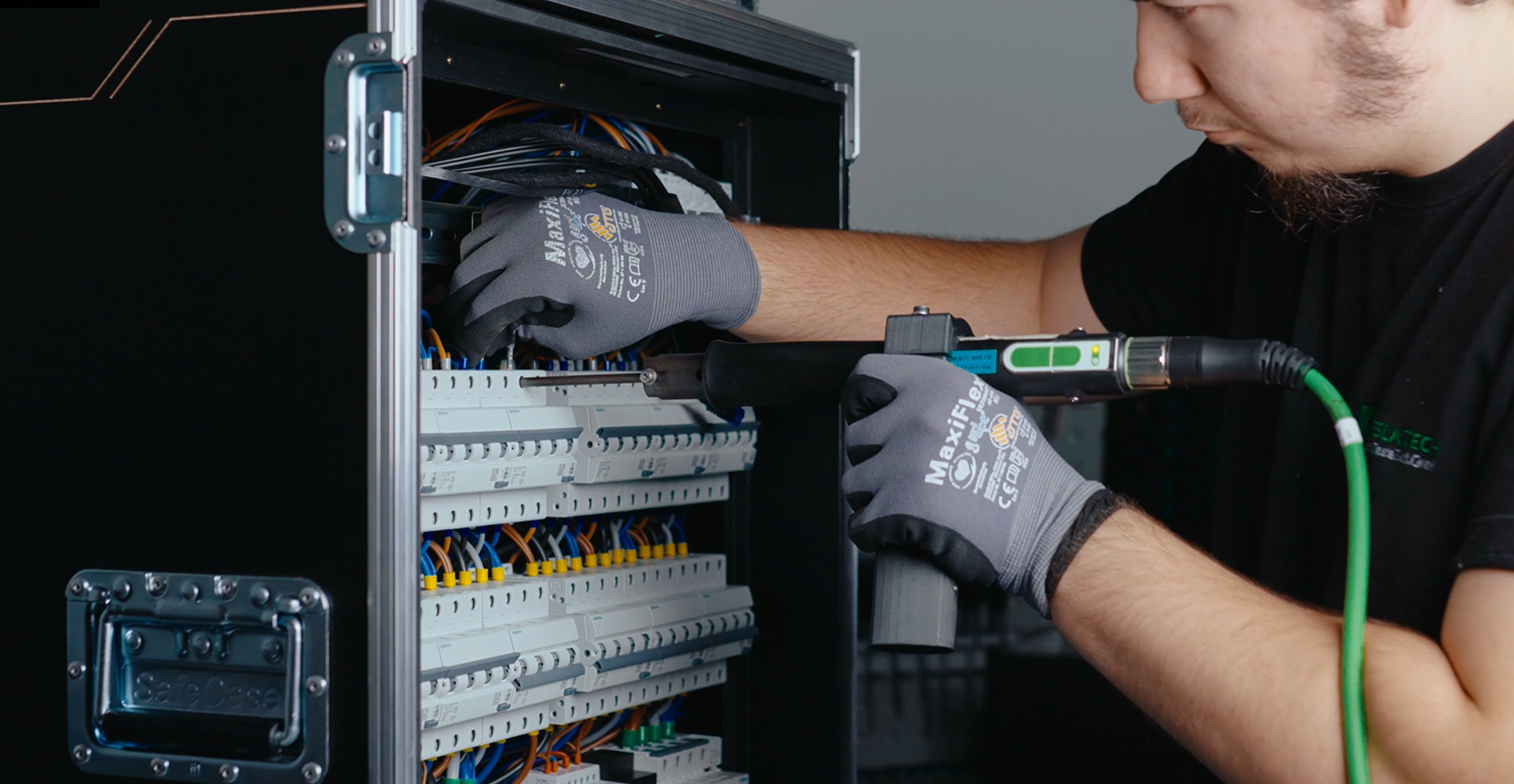 Technician wiring protection devices inside a flightcase PDU